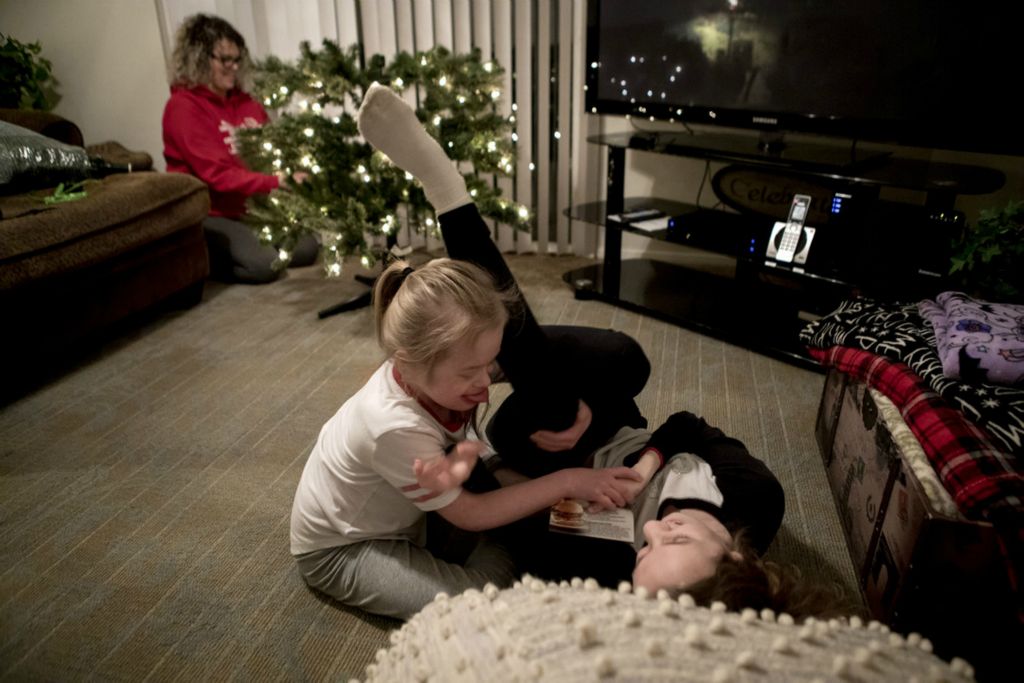 First Place, Feature Picture Story - Jessica Phelps / Newark Advocate, “Living on Love”Enjoying the laughter of her two girls wrestling, Leah puts together the Christmas tree they then decorated together December 6, 2019. Leah kept her tree up for months after Christmas because she loved the lights so much. The family was also waiting for a big snow to celebrate a 'White Christmas' with her older children.